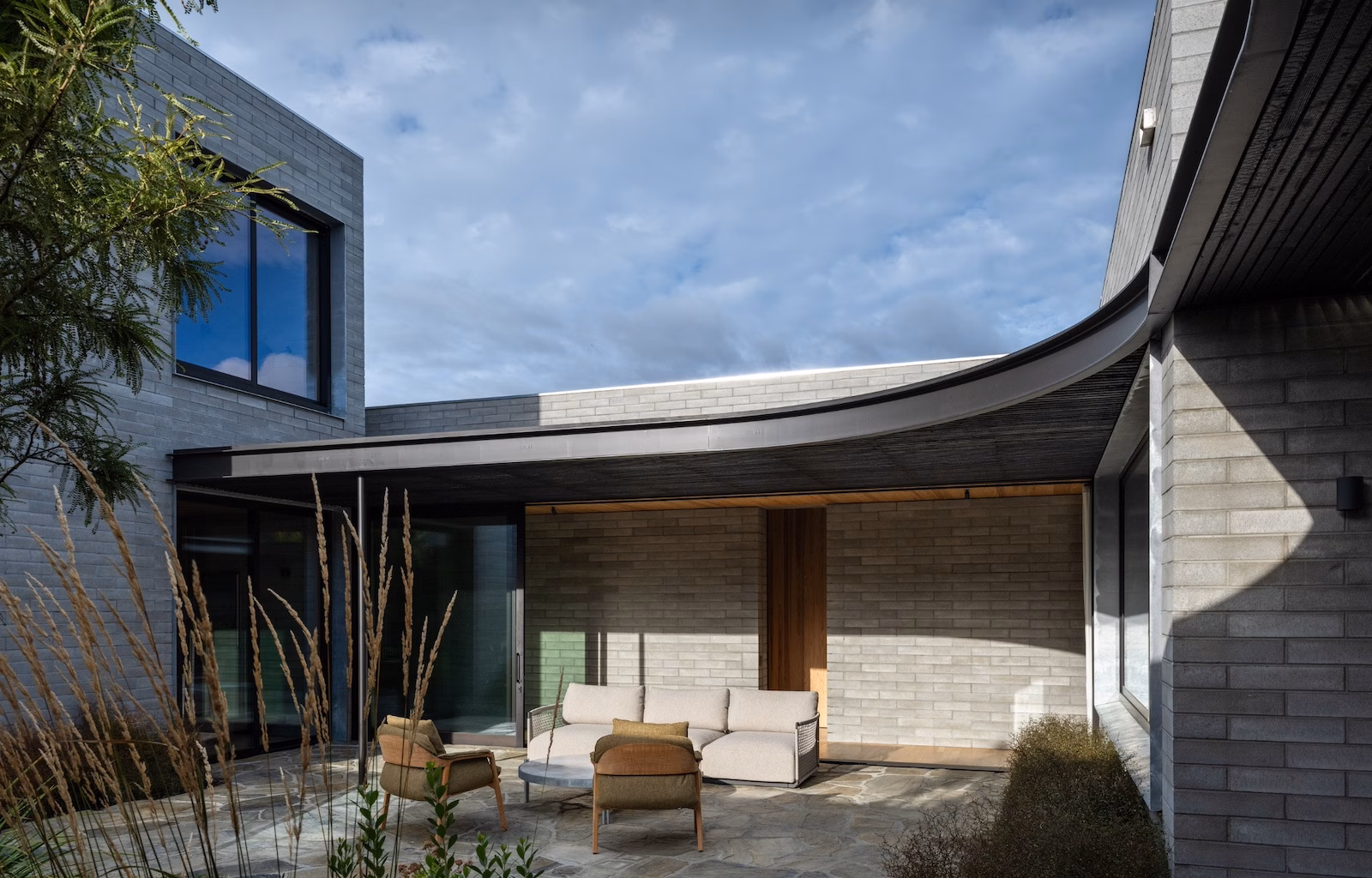Te Mata House in Tukituki Valley with Viblock charcoal honed masonry and views to Te Mata Peak