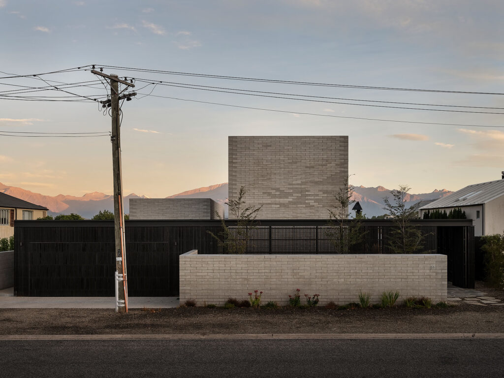 Concrete wall built with Viblock 390 Series Half Concrete Bricks in grey, Central Otago backdrop